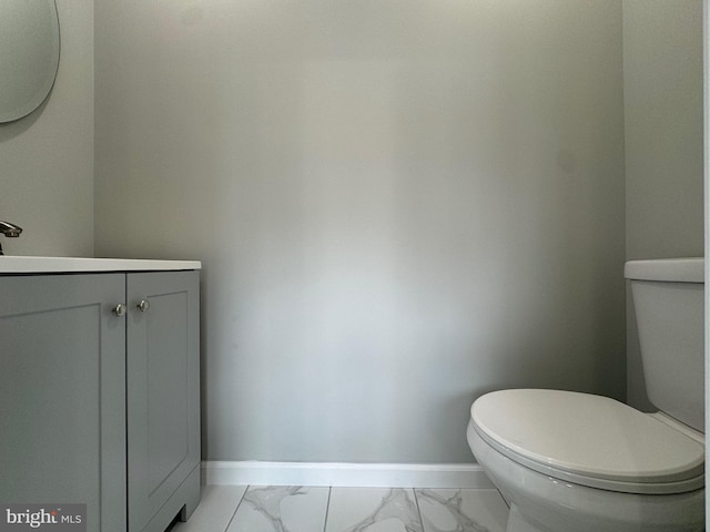 bathroom with tile patterned floors, vanity, and toilet