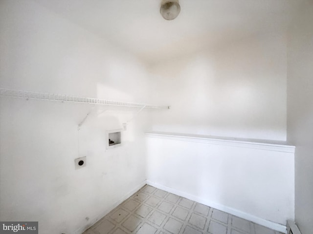 clothes washing area featuring hookup for an electric dryer, washer hookup, and a baseboard radiator