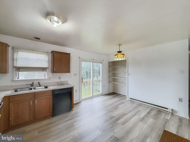 kitchen featuring dishwasher, sink, hanging light fixtures, light hardwood / wood-style flooring, and baseboard heating