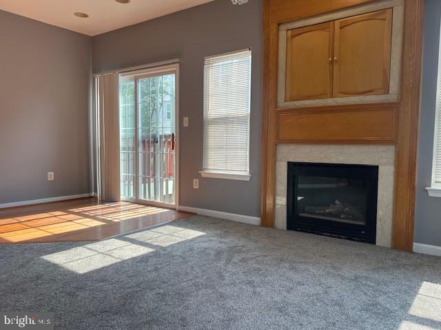 unfurnished living room featuring carpet flooring