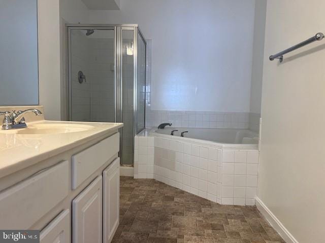 bathroom with separate shower and tub and vanity