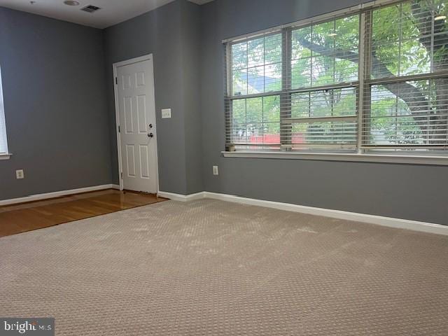 empty room featuring wood-type flooring