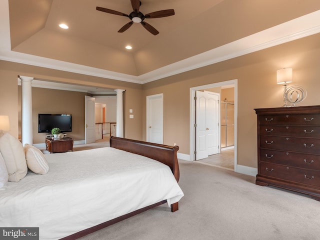 bedroom featuring crown molding, light carpet, ceiling fan, ornate columns, and a raised ceiling