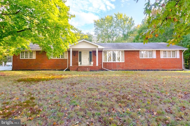 ranch-style home with a front yard