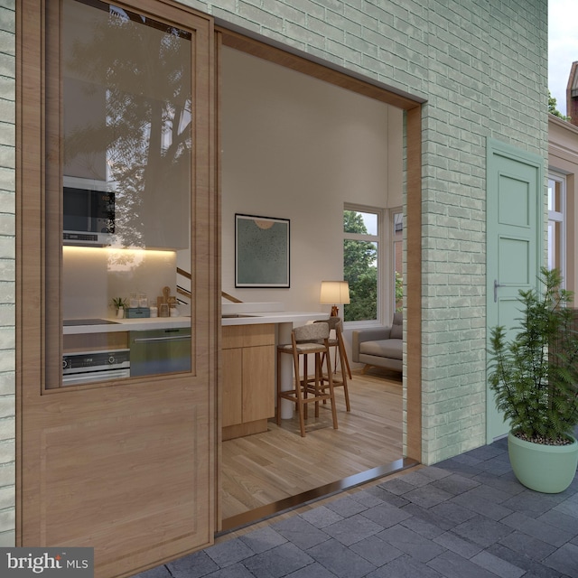 entrance to property featuring exterior kitchen