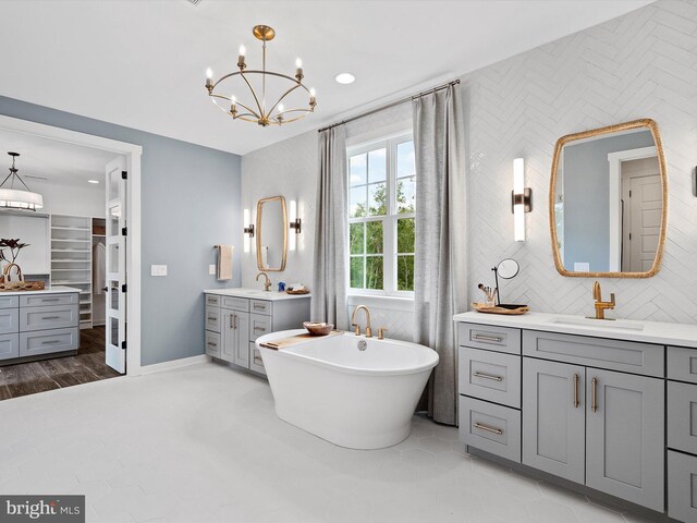 410 Darrow Rd Devonshire, Unit Devonshire, York, PA 17404 - full bath featuring two vanities, a freestanding bath, a chandelier, and recessed lighting