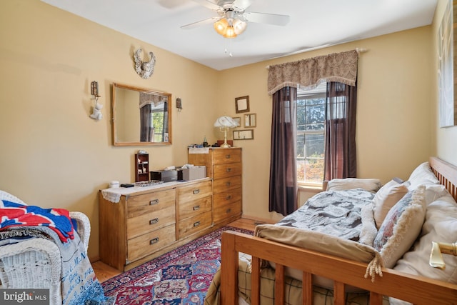 bedroom featuring light hardwood / wood-style flooring and ceiling fan