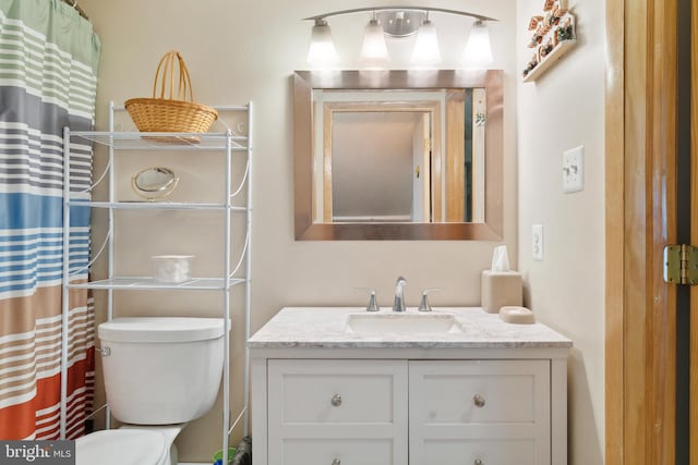 bathroom with vanity and toilet