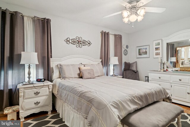 bedroom featuring wood-type flooring and ceiling fan