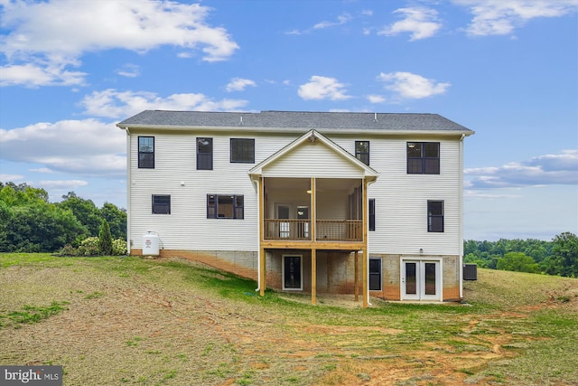 back of property featuring french doors