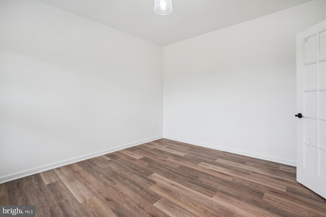 empty room featuring hardwood / wood-style flooring