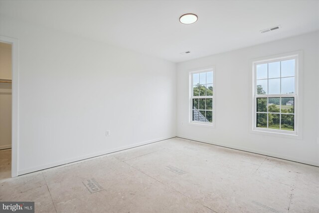 spare room with plenty of natural light