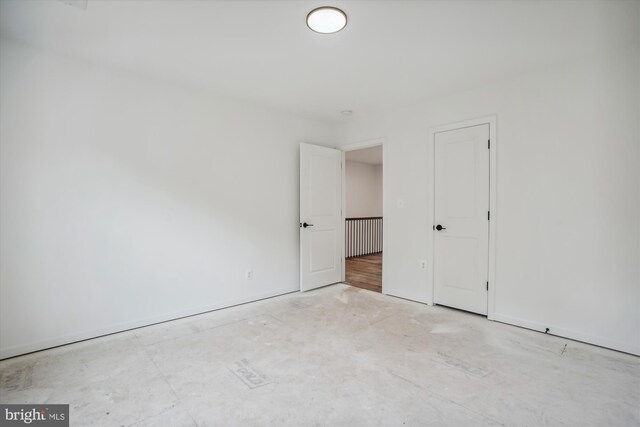 empty room with hardwood / wood-style floors