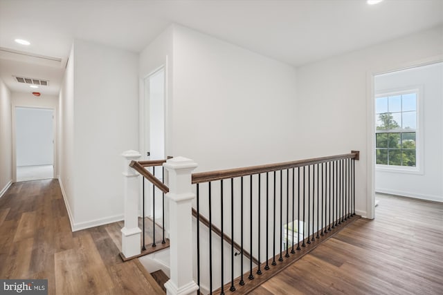 hall with wood-type flooring