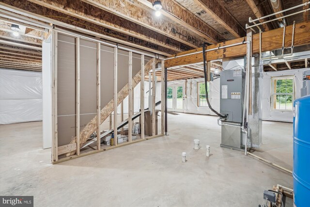 basement featuring heating unit