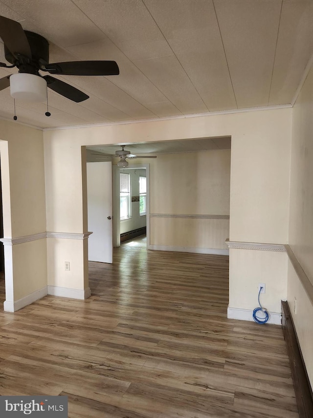 unfurnished room featuring hardwood / wood-style flooring and ceiling fan