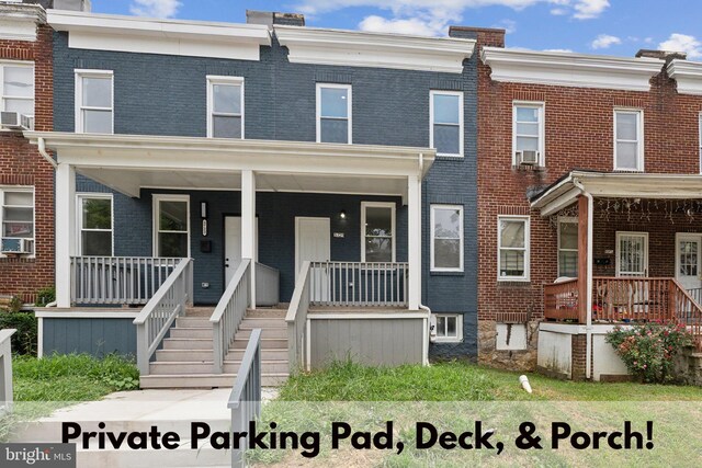 view of front of home featuring covered porch and cooling unit