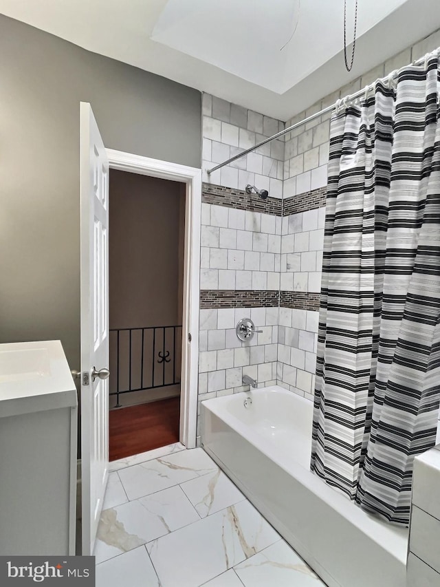 bathroom with vanity, shower / bath combination with curtain, and tile patterned flooring