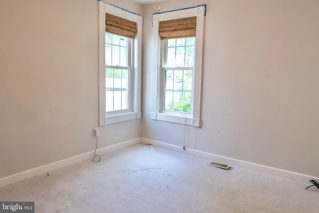 empty room featuring light colored carpet