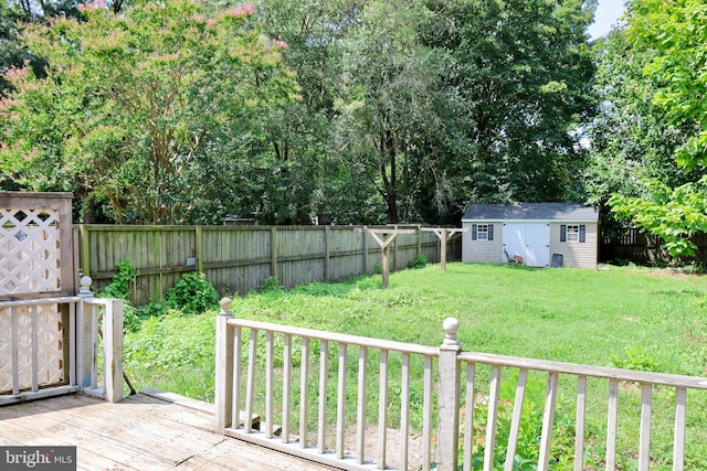 view of yard with a storage shed and a wooden deck