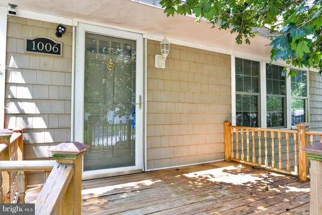 property entrance with a deck