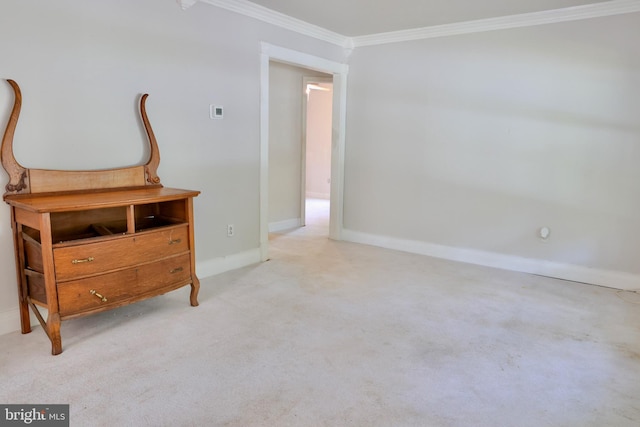 bedroom featuring baseboards, crown molding, and light colored carpet