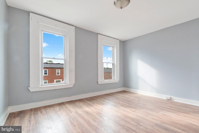 spare room with light hardwood / wood-style floors