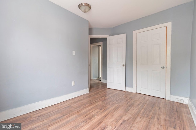 unfurnished bedroom featuring hardwood / wood-style floors