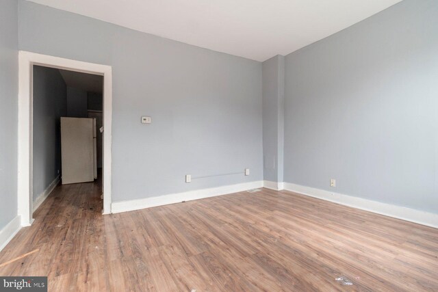 spare room featuring hardwood / wood-style flooring