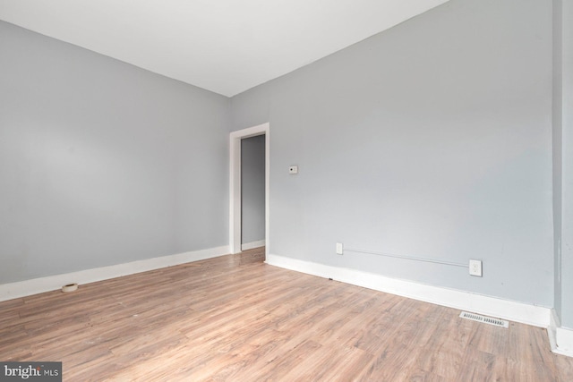 unfurnished room featuring light wood-type flooring