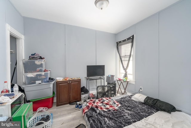 bedroom with light hardwood / wood-style floors