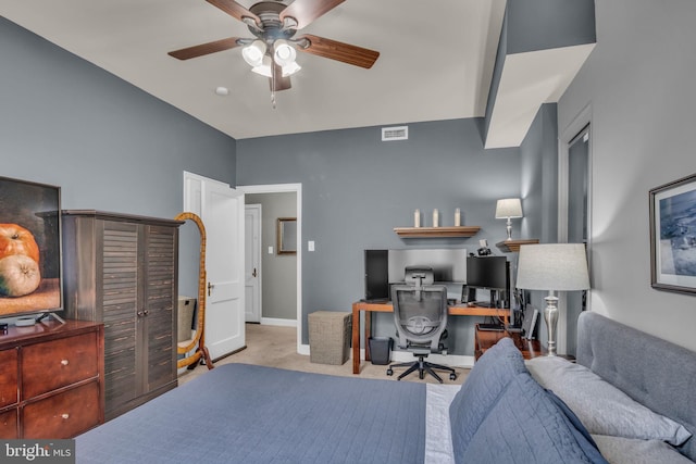 home office with ceiling fan and light colored carpet