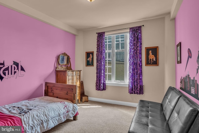 carpeted bedroom featuring multiple windows