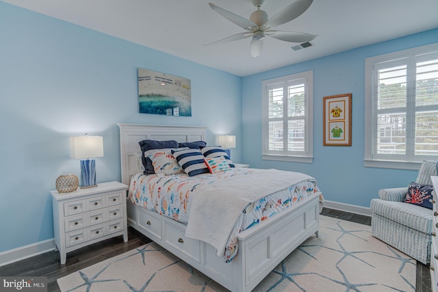 bedroom featuring hardwood / wood-style flooring and ceiling fan