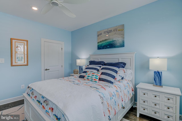 bedroom with dark wood-type flooring and ceiling fan