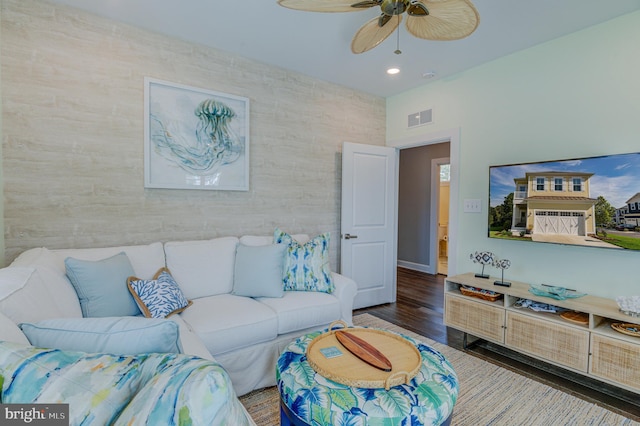 living room featuring hardwood / wood-style flooring and ceiling fan