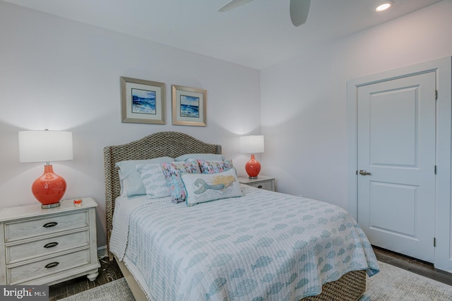 bedroom with dark wood-type flooring and ceiling fan