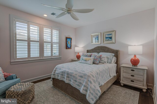 bedroom featuring ceiling fan and dark hardwood / wood-style flooring