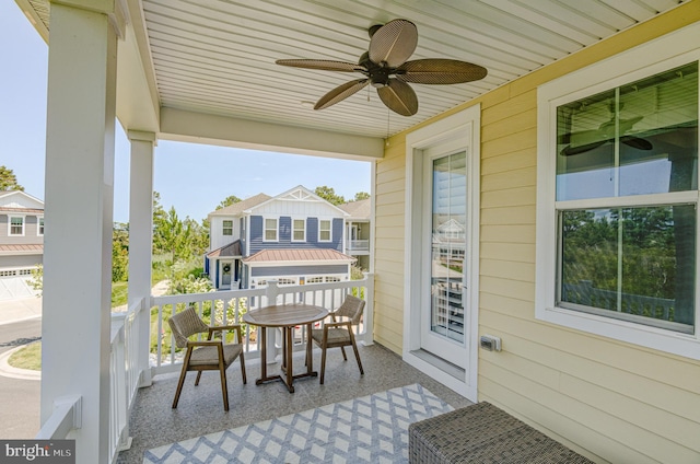 view of patio featuring ceiling fan and a porch