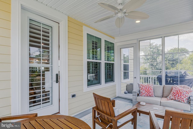 sunroom featuring wooden ceiling and ceiling fan