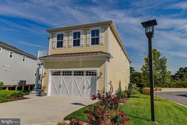 view of front of house featuring a garage and a front yard