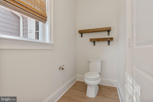 bathroom featuring baseboards and wood finished floors