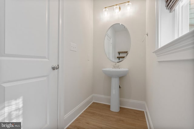 bathroom featuring baseboards and wood finished floors