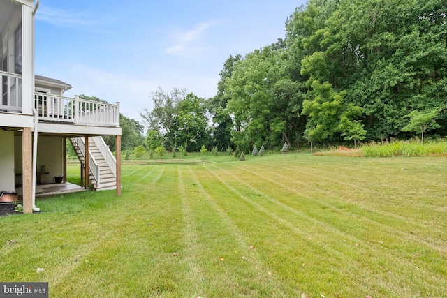 view of yard with a wooden deck