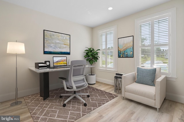 office area with light wood-type flooring, baseboards, and recessed lighting