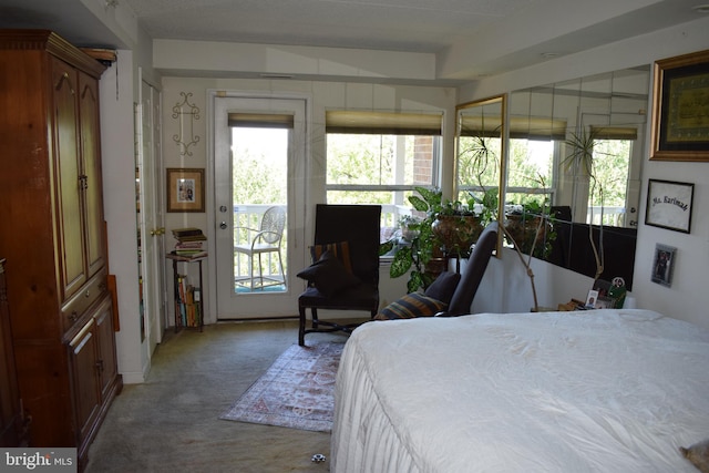 bedroom featuring light carpet and access to outside