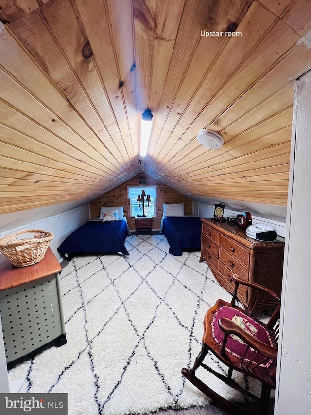 bedroom featuring vaulted ceiling and wood ceiling