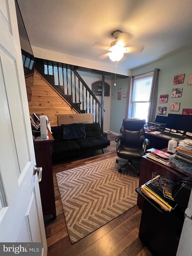 living room with ceiling fan and hardwood / wood-style floors