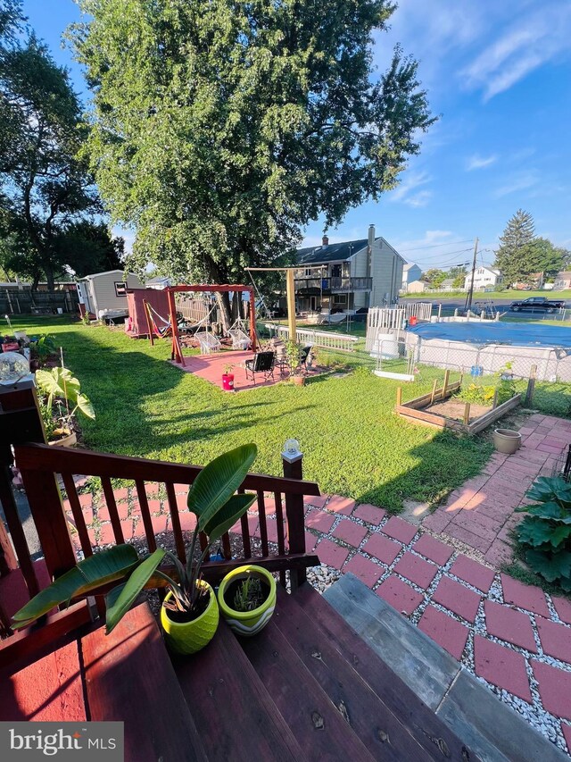 view of yard featuring a swimming pool side deck