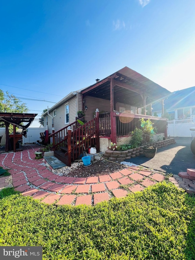 rear view of house featuring a patio